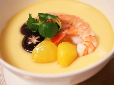 Chawanmushi. A savoury egg custard meal. The custard consists of an egg mixture flavored with soy sauce, dashi, and mirin, with numerous ingredients such as shiitake mushrooms, kamaboko, yuri-ne (lily root), ginkgo and boiled shrimp placed into a tea-cup-like container.